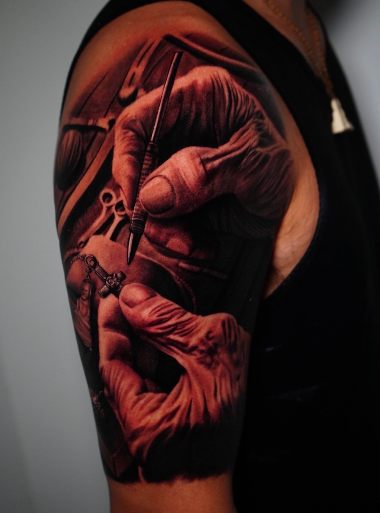 Realism tattoo of detailed hands and tools